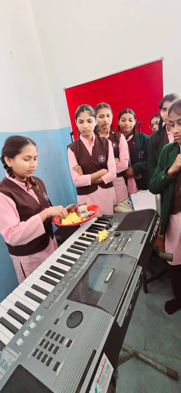 A student playing the keyboard during a school music activity