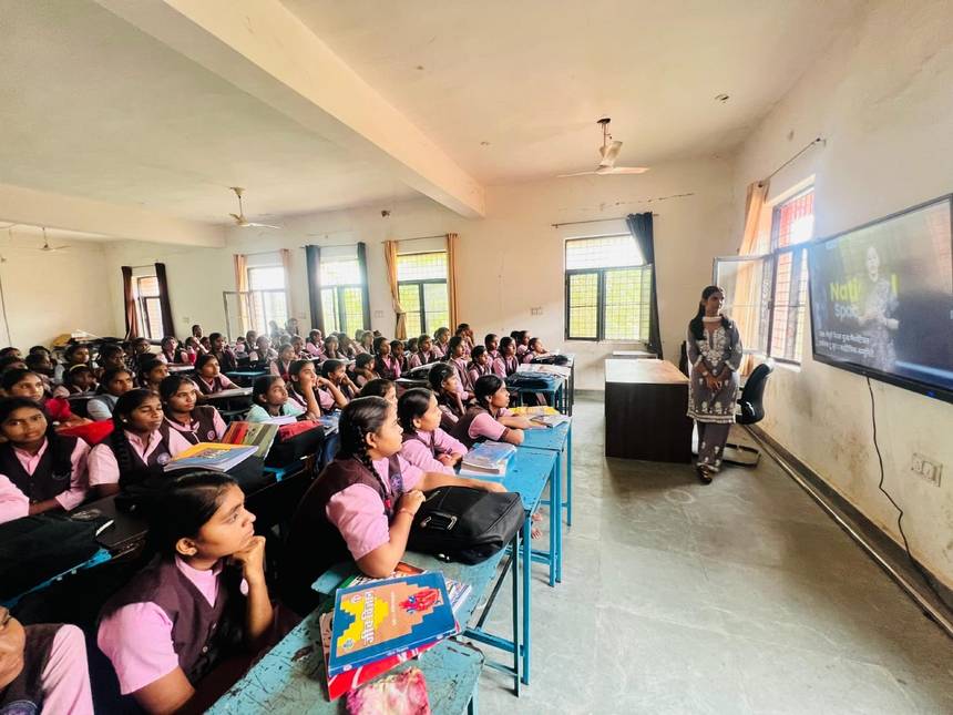 Students watching a lesson on the smart class screen in their classroom