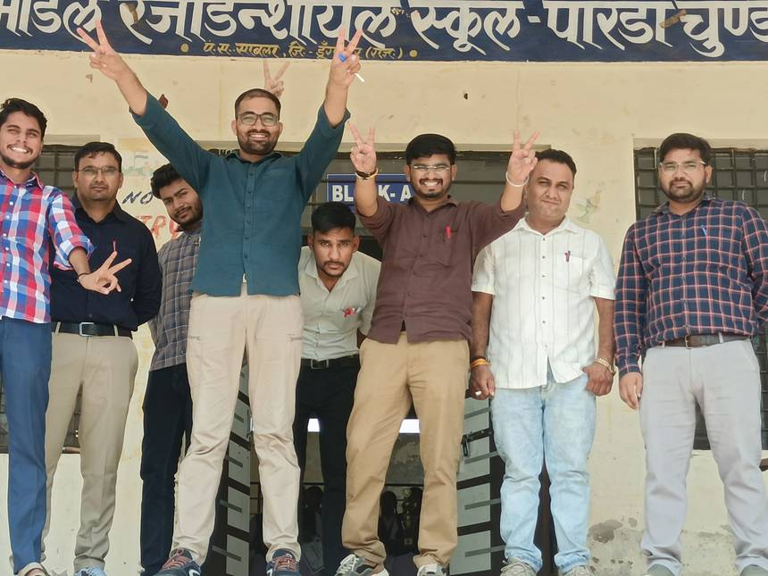 Teachers of EMRS Parda Chundawat outside the Block A entrance
